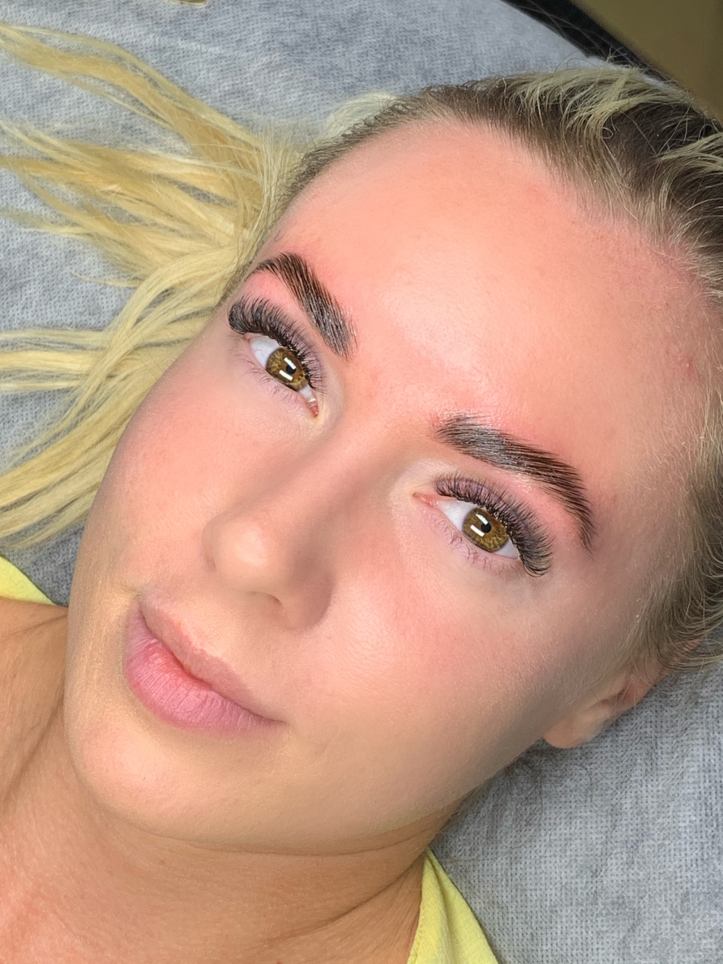 Eyebrows after brow lamination lashed and proud